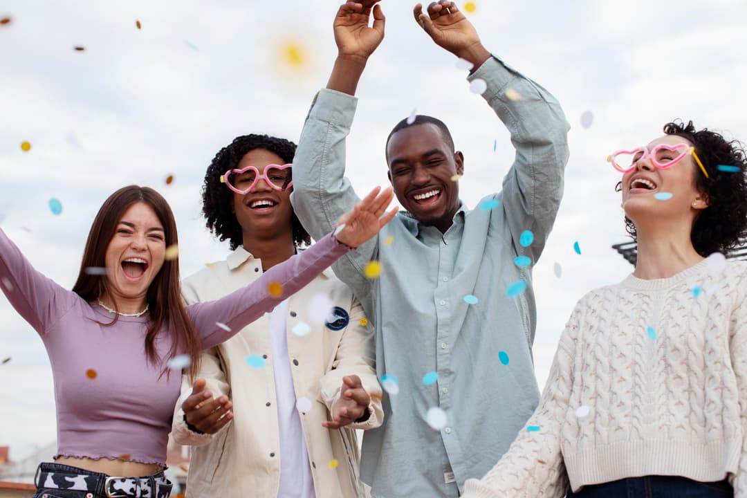 Happy people celebrating lottery wins with confetti
